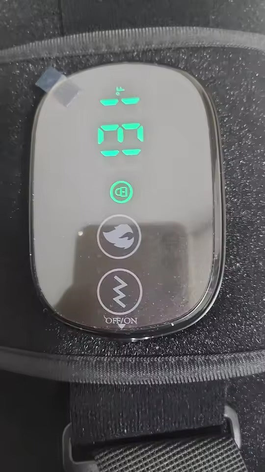 Real customer photo close-up of EvoLif wireless heated vibration belt control panel showing heat, vibration, and lock indicator.